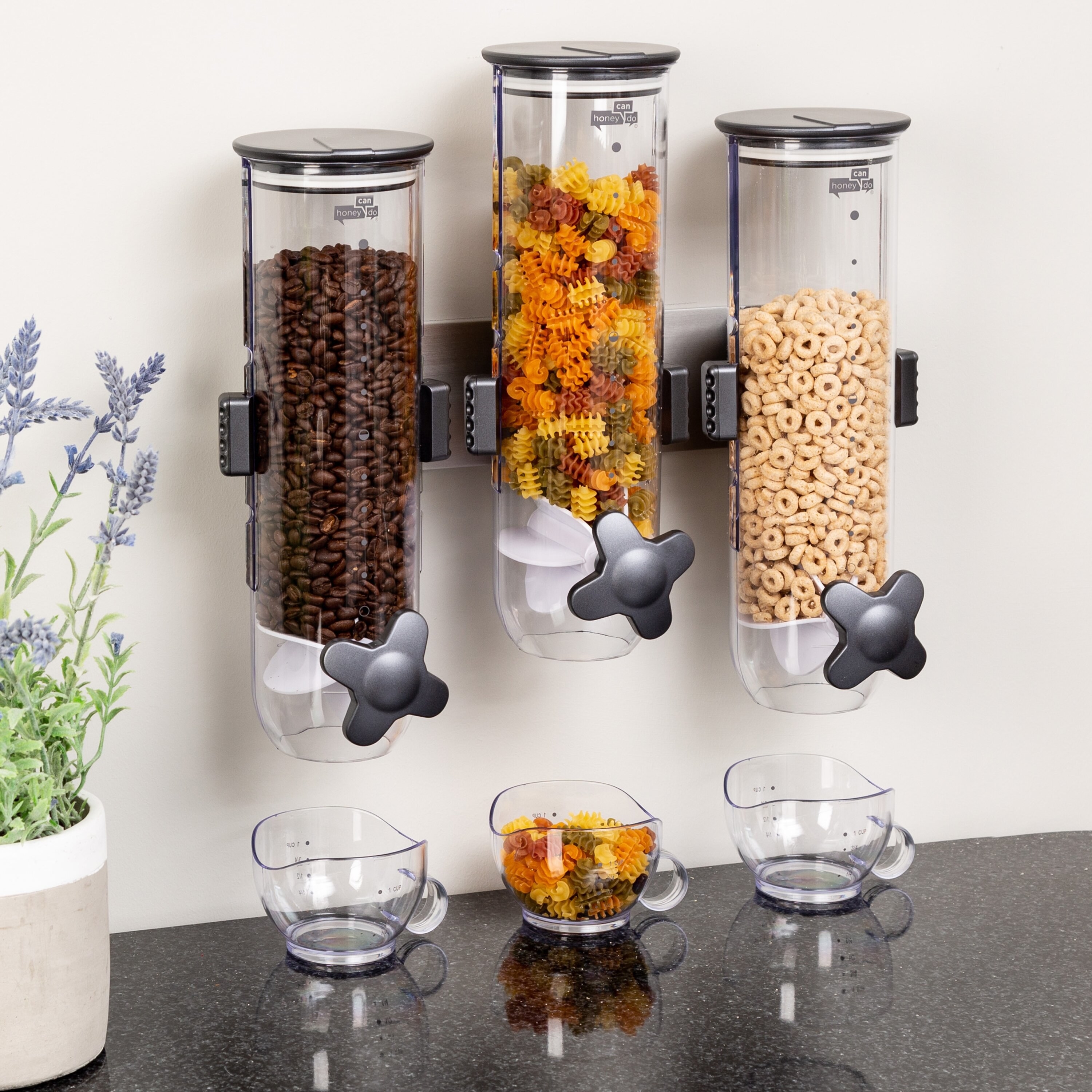 The there dispensers with beans, pasta, and cereal in them