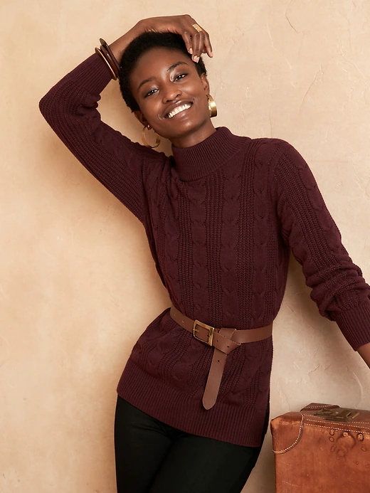 A woman wearing the sweater in burgundy