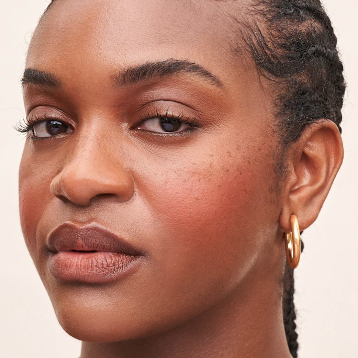 model wearing freck on cheeks