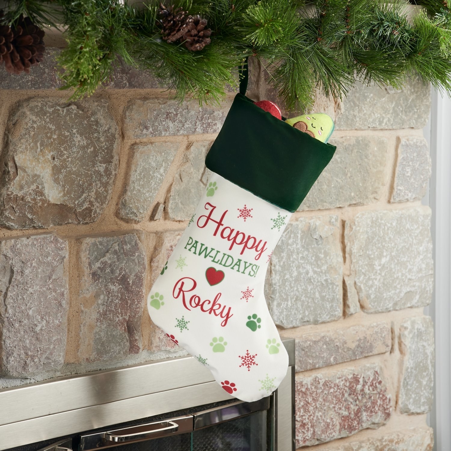 A stocking that says &quot;Happy Paw-lidays&quot;.