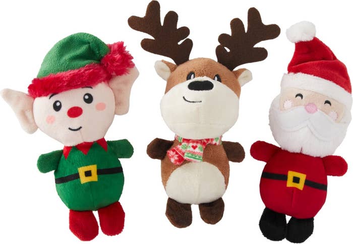 A trio of reindeer, Santa, and elf toys.