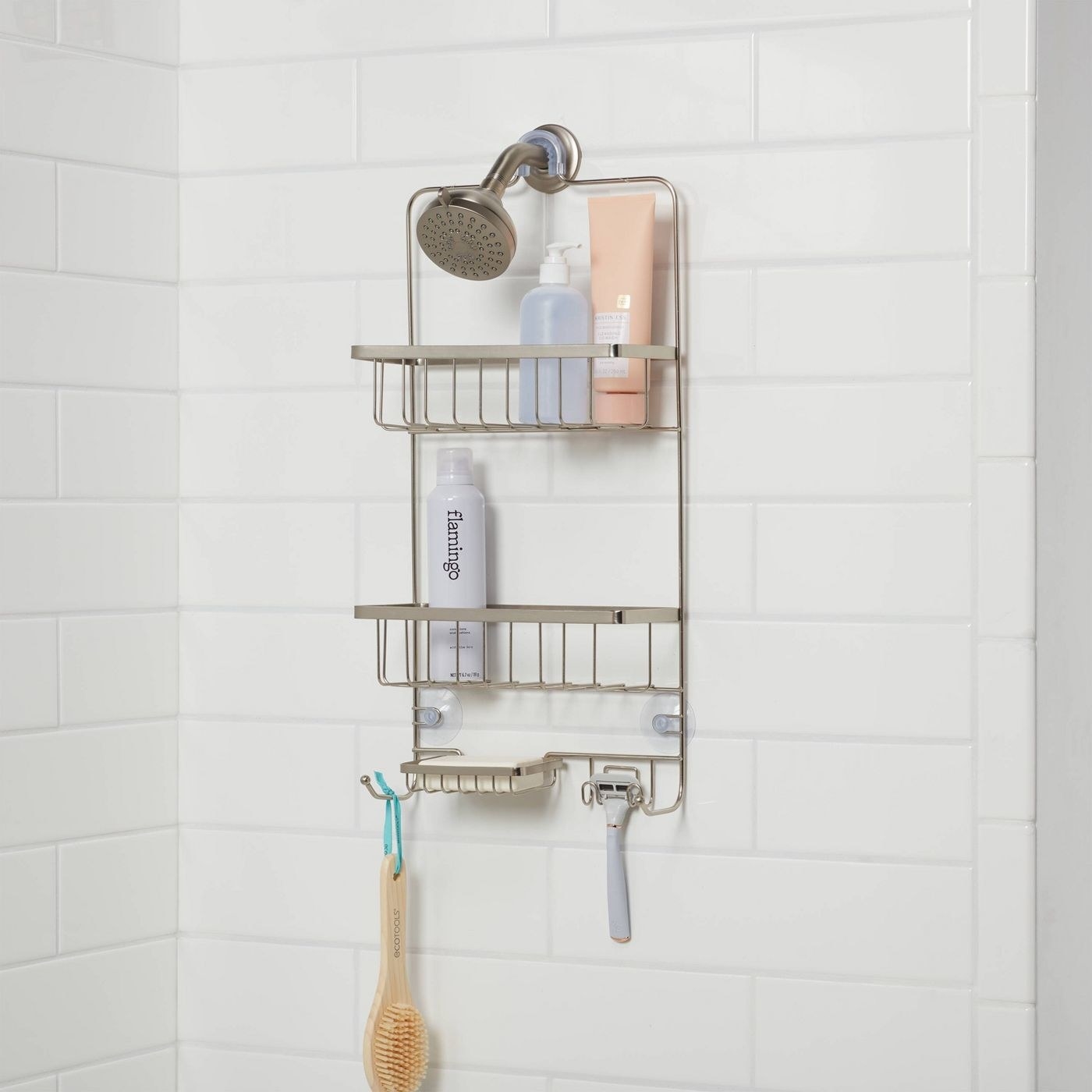 The shower caddy hanging over the showerhead.