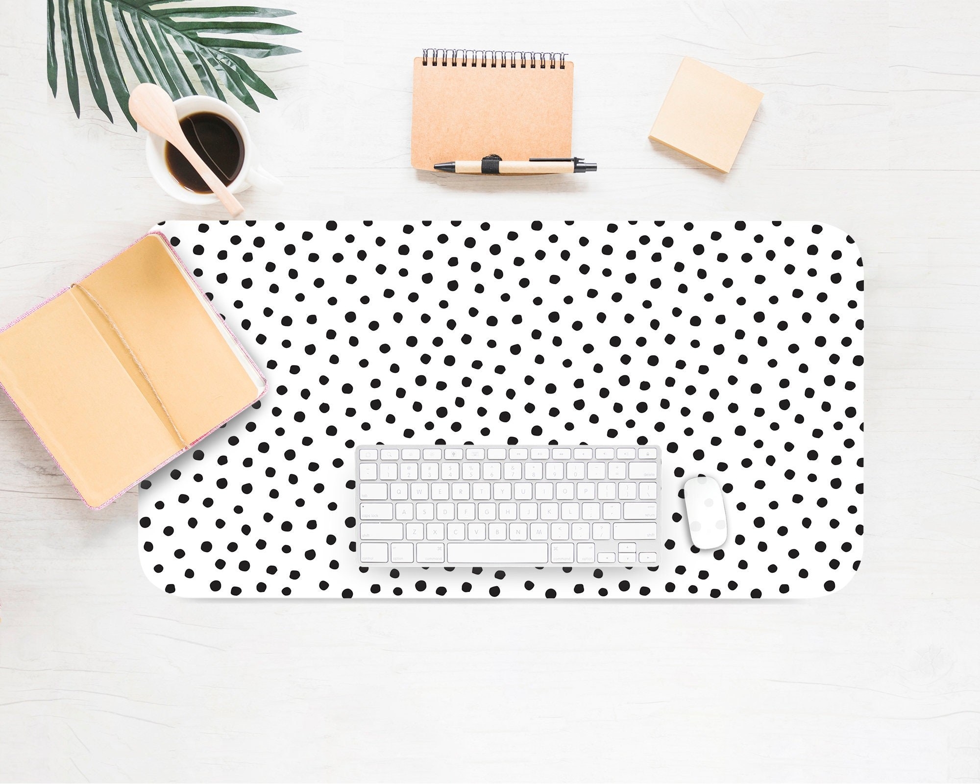 a product shot of the Dalmatian desk mat with a keyboard and mouse on top of it