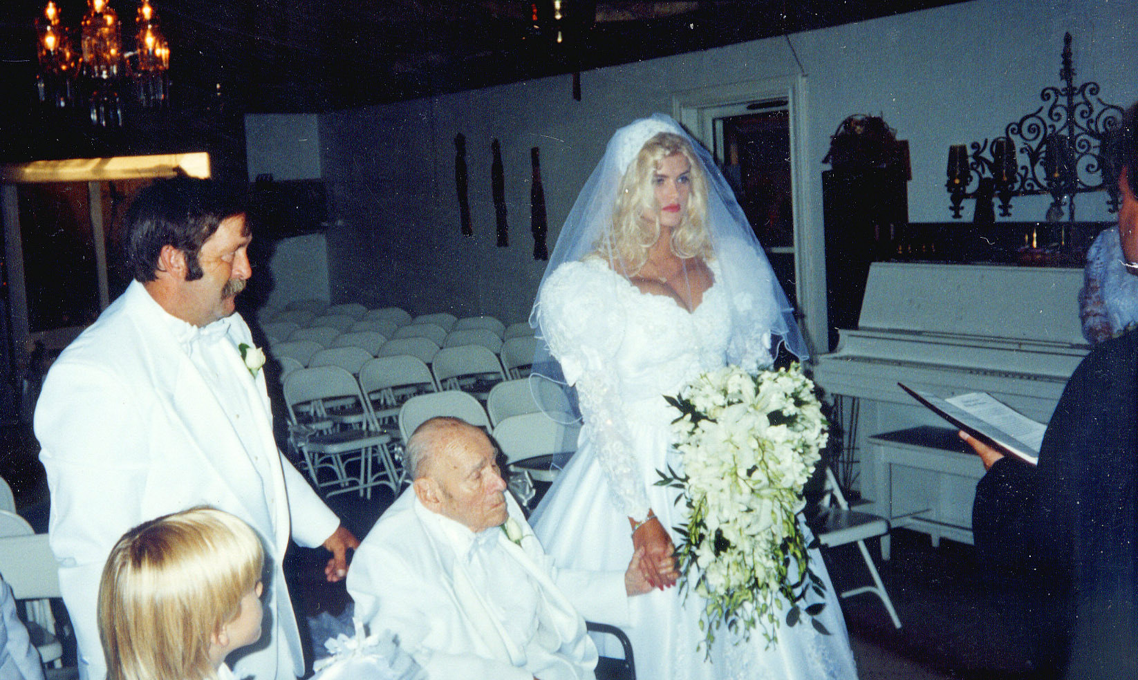 Anna Nicole Smith marries oil tycoon J. Howard Marshall II in Texas, on June 27, 1994