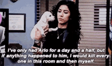Rosa is holding up a white puppy. She is saying, &quot;I&#x27;ve only had Arlo for a day and a half, but if anything happened to him, I would kill everyone in this room and then myself