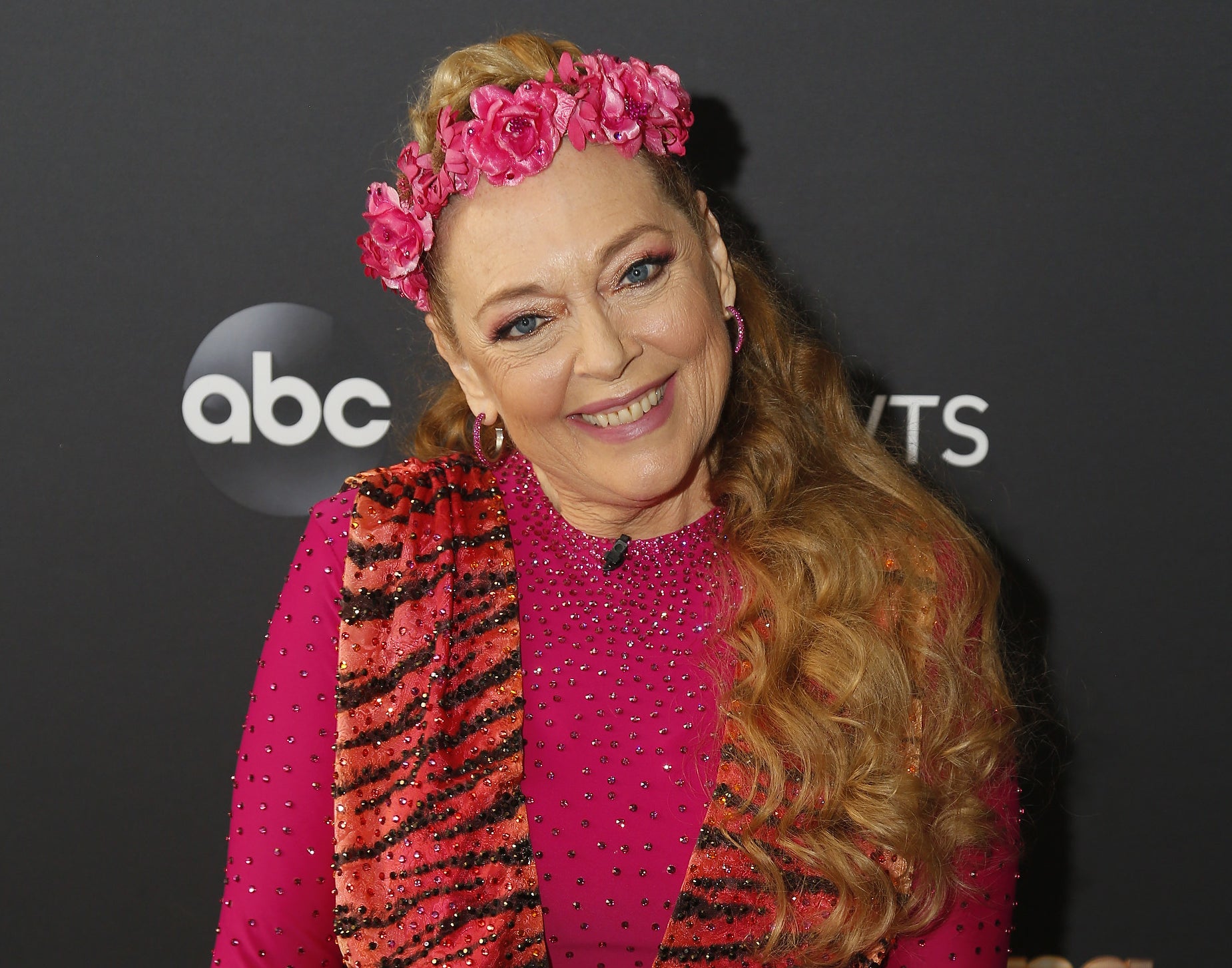 Carole wears a flower crown at an event