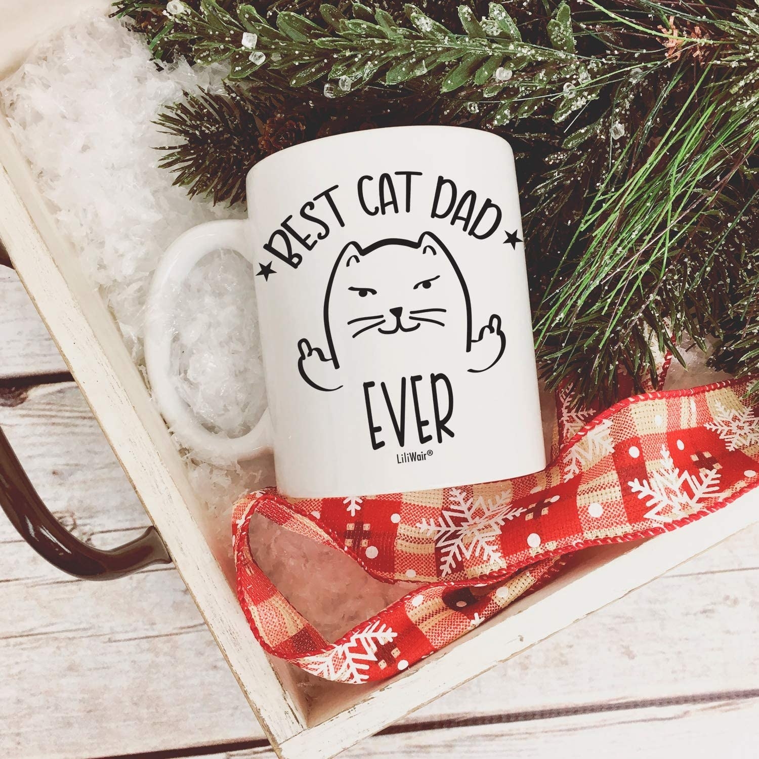 White mugs with a cartoon cat giving two middle fingers with text on image that says best cat dad ever