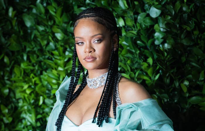 Rihanna poses for a photo at an event
