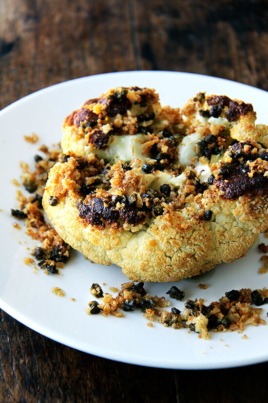 Whole roasted cauliflower with fried capers.