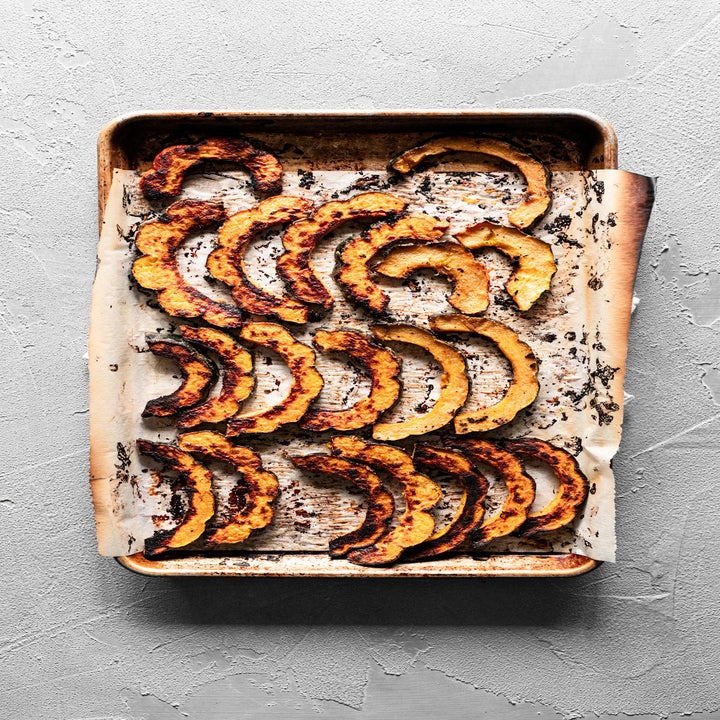 Acorn squash on a sheet pan.