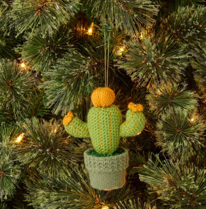 The cactus tree in a pot ornament hanging on a tree