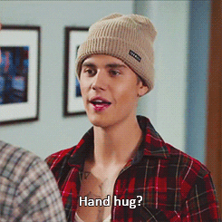 A gif of Justin Bieber high fiving