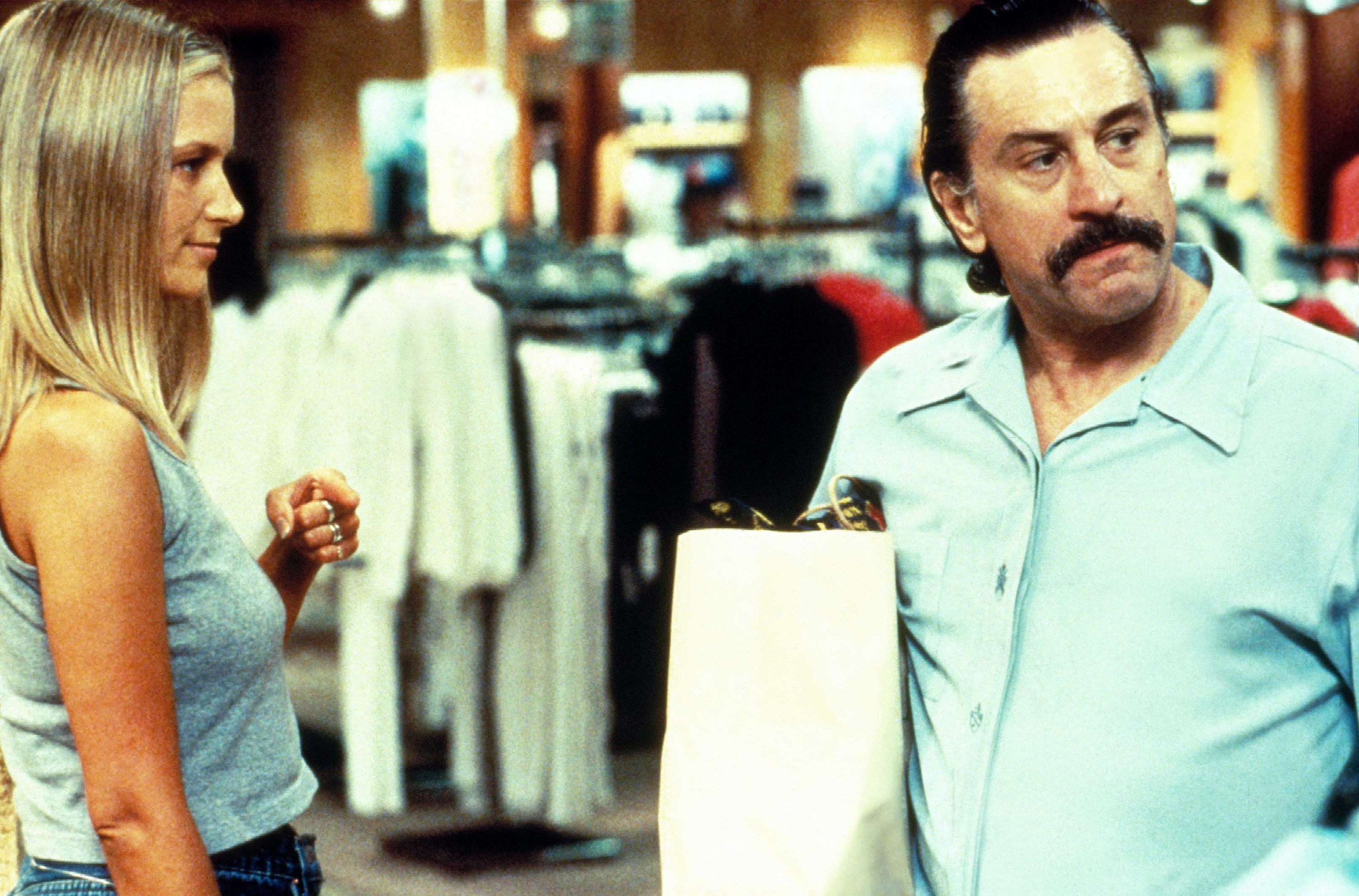 Bridget Fonda and Robert De Niro shop together in a mall