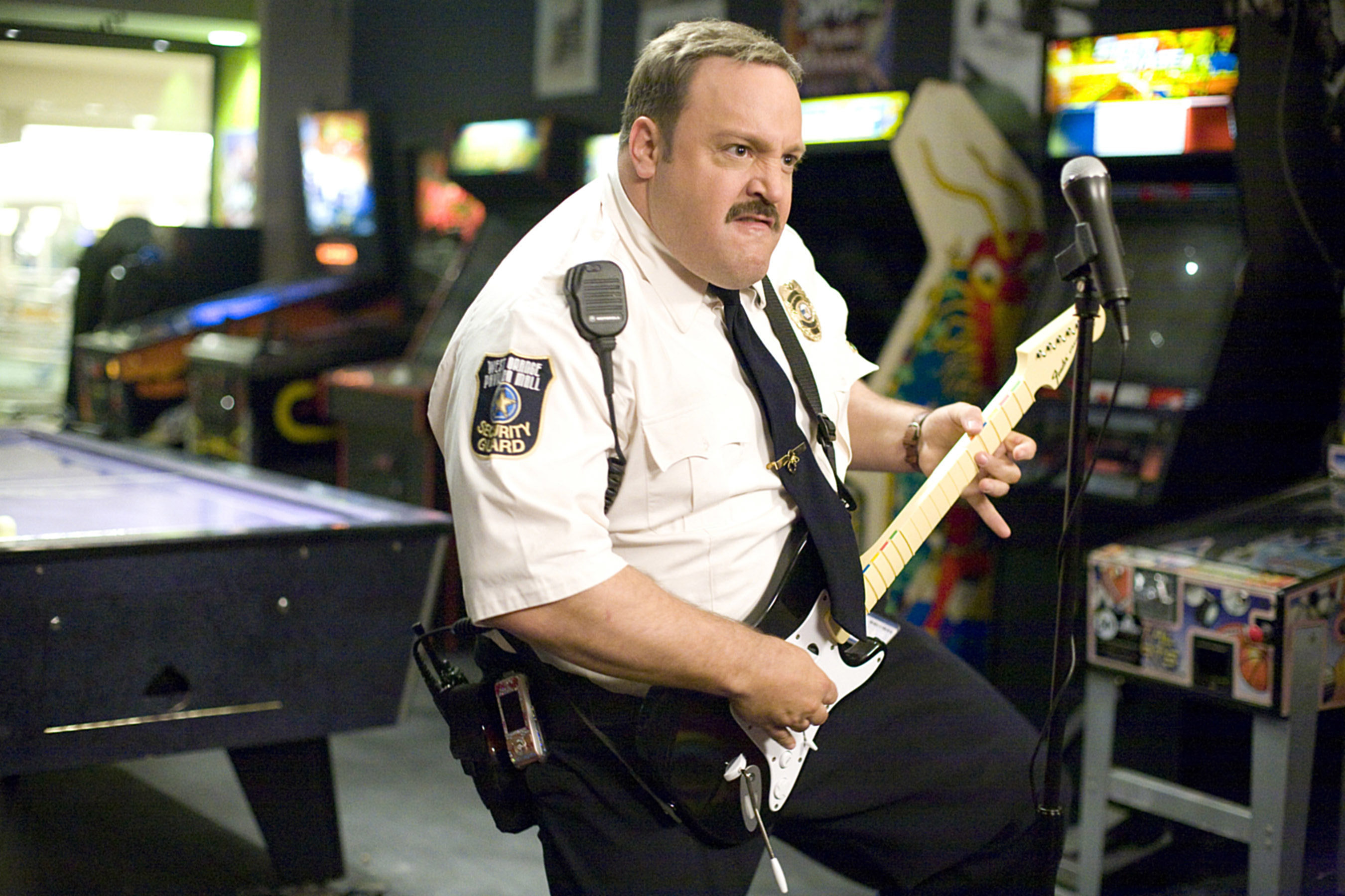 Kevin James plays Guitar Hero in a mall arcade