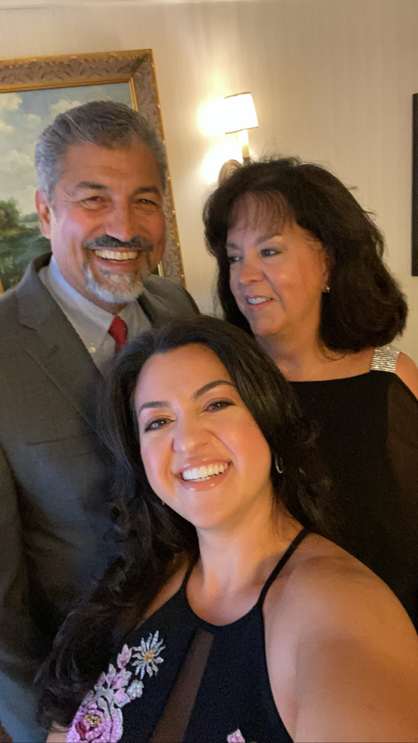 The author smiling with her familiy