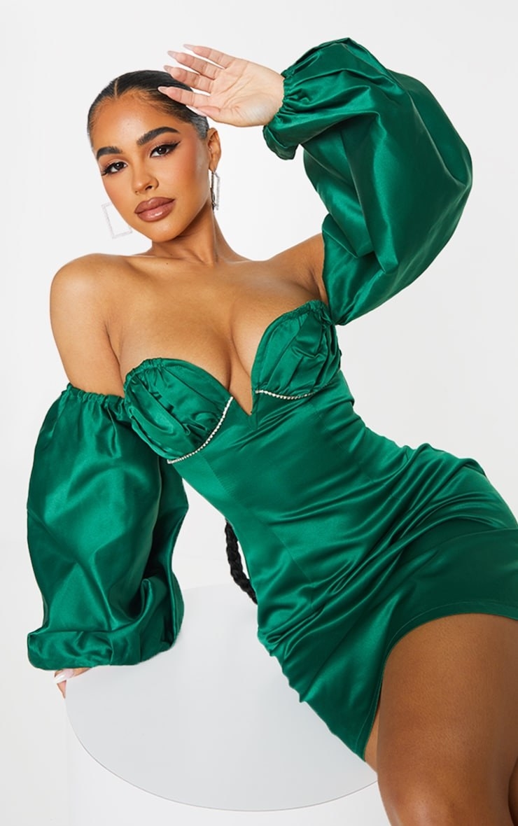 model in off the shoulder embellished green mini