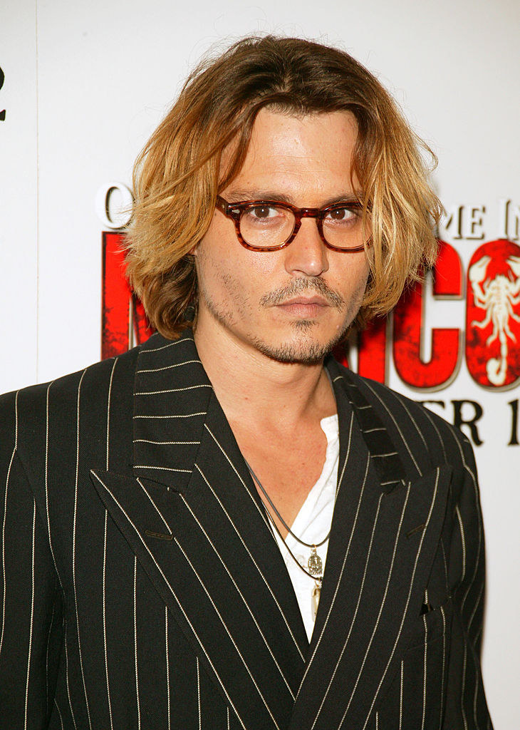 Johnny in a blazer and eyeglasses at once upon a time in mexico premiere