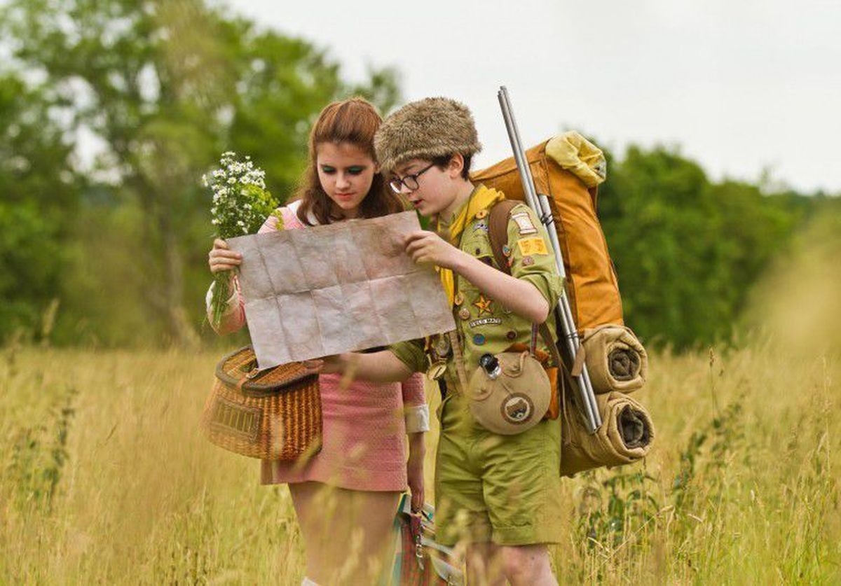 Two kids backpacking in the woods
