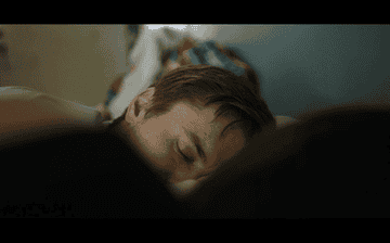 A gif of Leah and Nick in bed from &quot;The End of Us&quot; film
