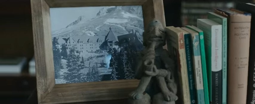 A framed picture of the Overlook Hotel on a shelf in "The Dark Tower"