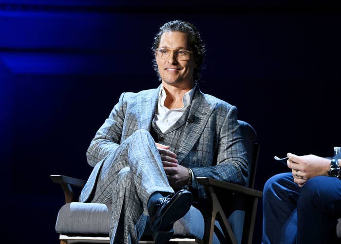 Matthew sitting during a speaking panel