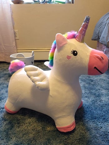 Reviewer's photo of the furry inflatable unicorn