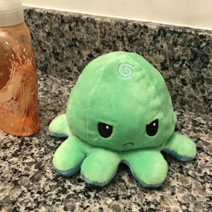 the toy reversed to the green frowning face