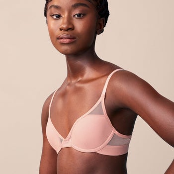 Model wearing light pink bra