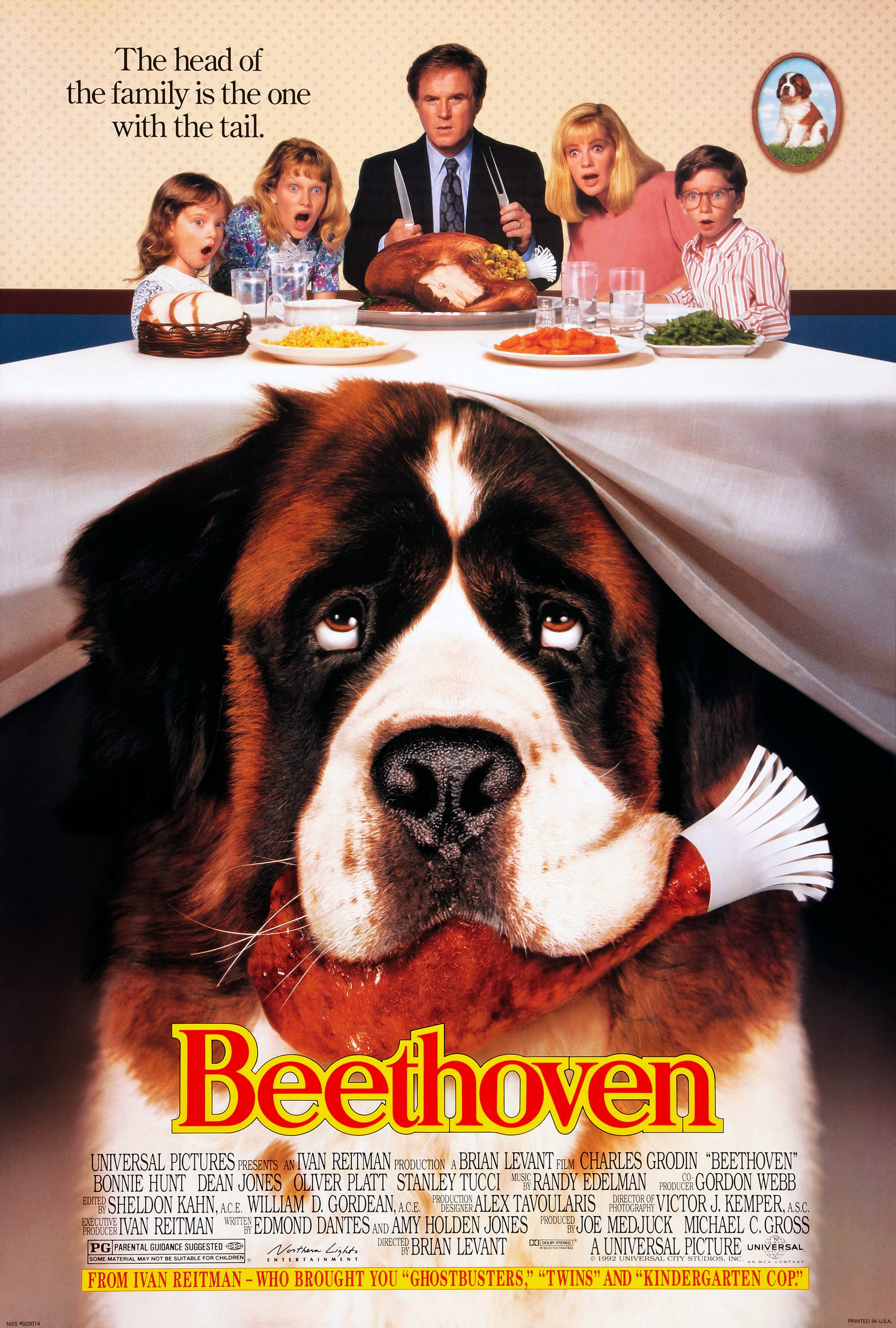 Beethoven movie poster shows close up of dog hiding under a table with family looking on above; title text in red font below