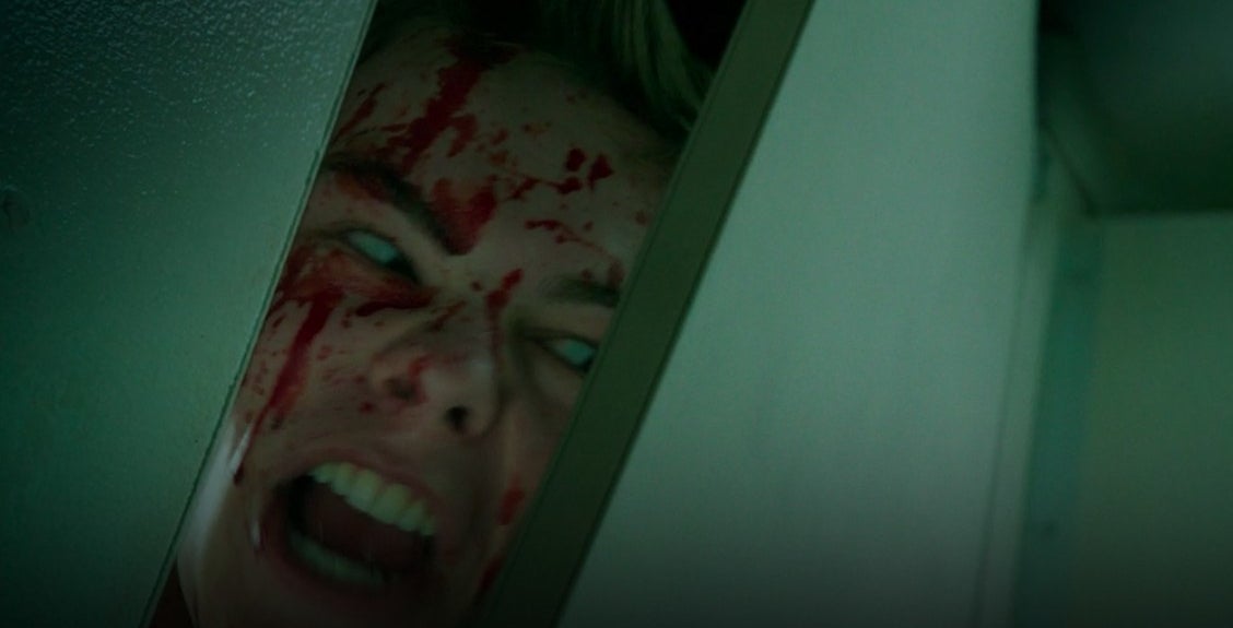 Henry screaming with his bloodied head pressing against a bathroom stall in &quot;It: Chapter Two&quot;