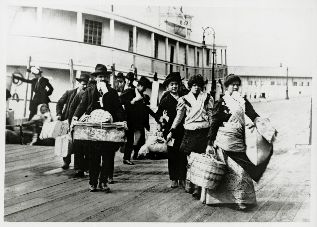 immigrants coming off a boat at ellis island