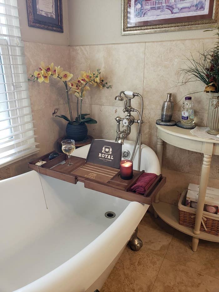Reviewer&#x27;s bathtub with bath tray on top