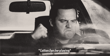 A close up of Nick Miller as he fists pump to &quot;Cotton Eye Joe&quot;