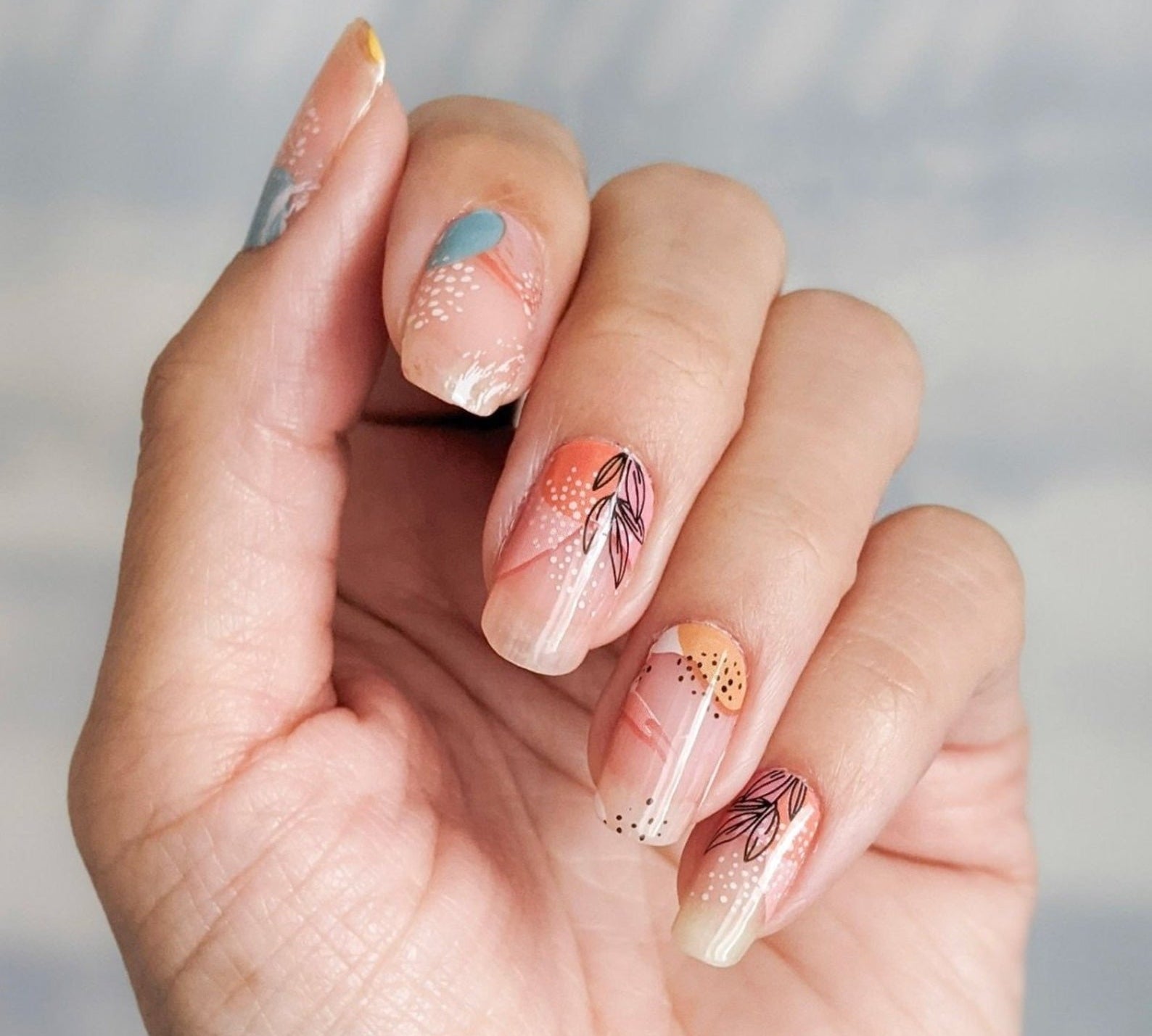a model wearing the nail wraps