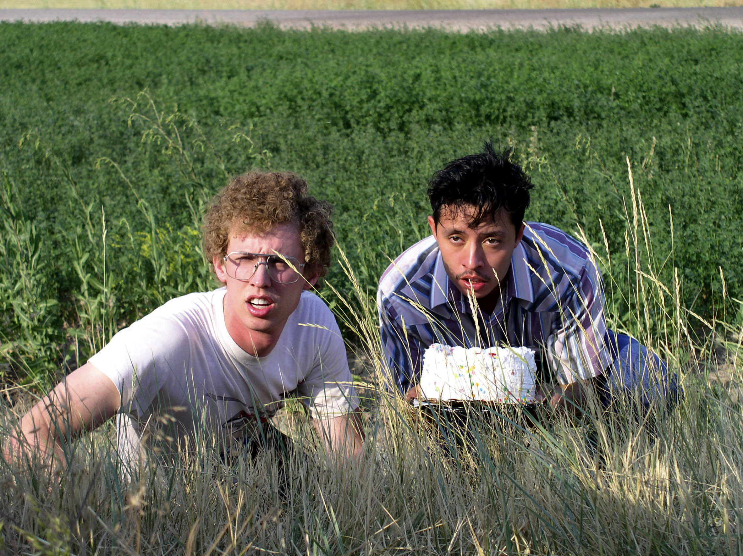 Jon Heder and Efren Ramirez hiding behind some weeds