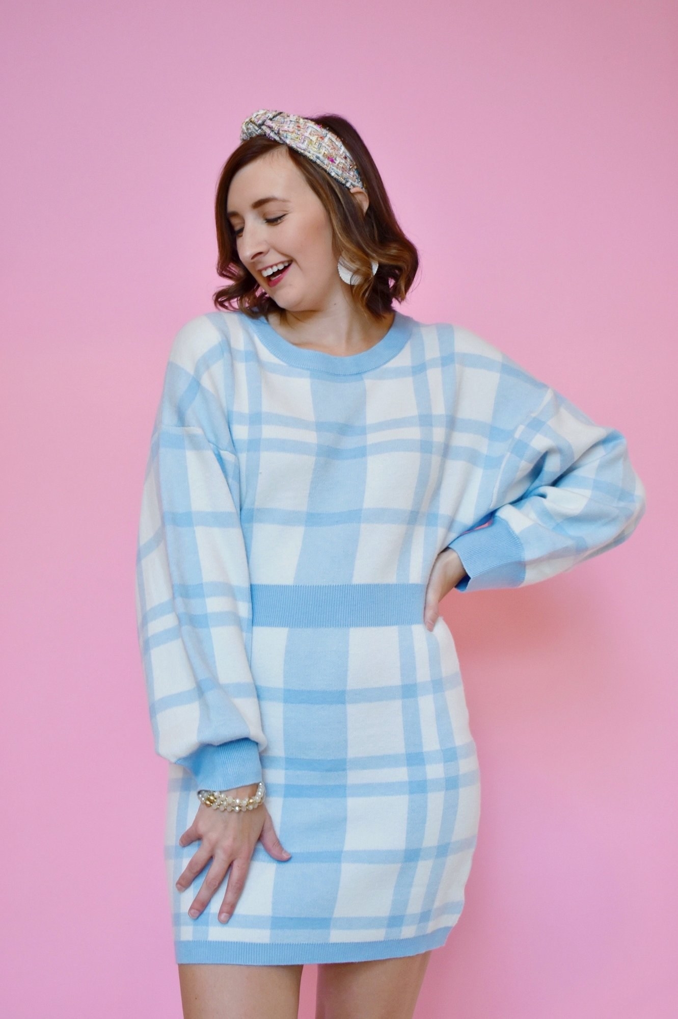 Model in white and light blue plaid long sleeve mini sweater dress