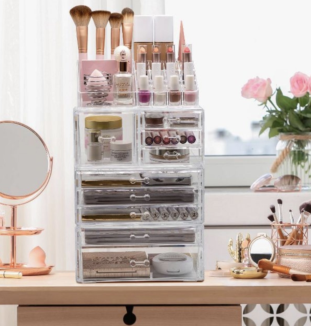 a tiered makeup organizer on a vanity desk