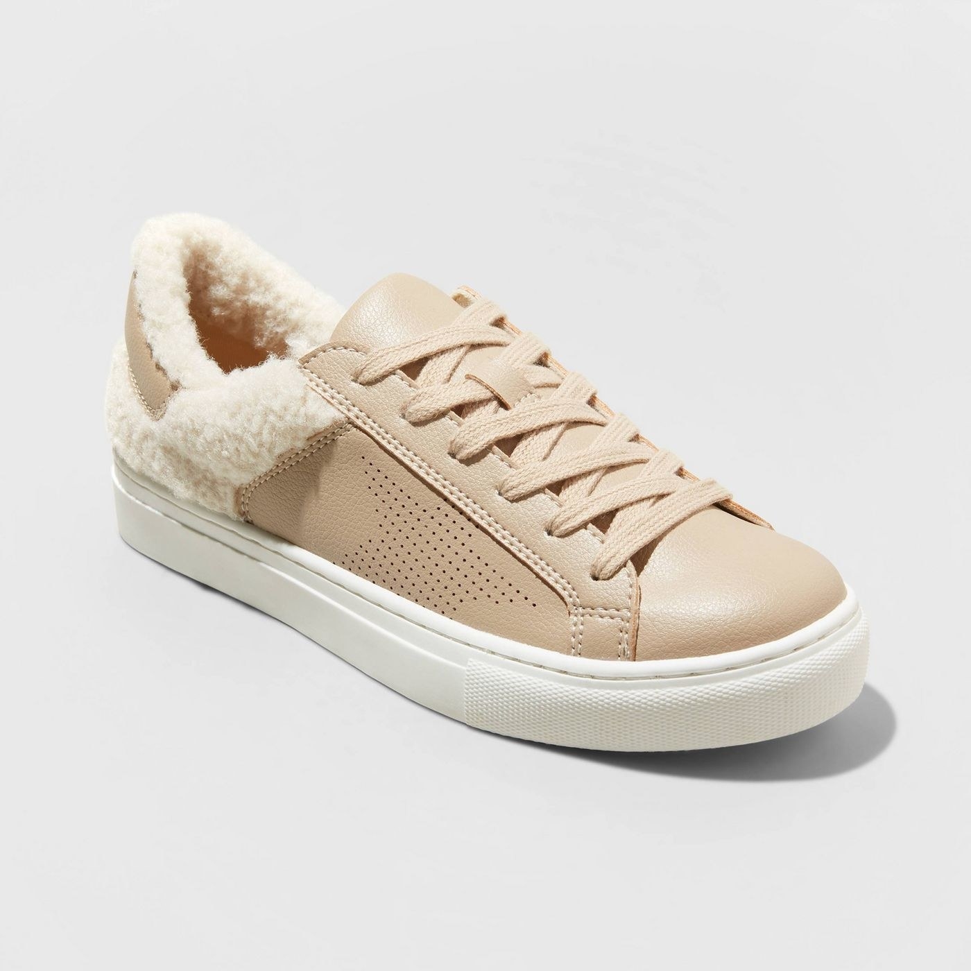 The tan sneaker with white laces, and star detail