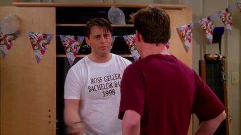 Joey wearing a &quot;Ross Geller Bachelor Bash 1998&quot; T-shirt