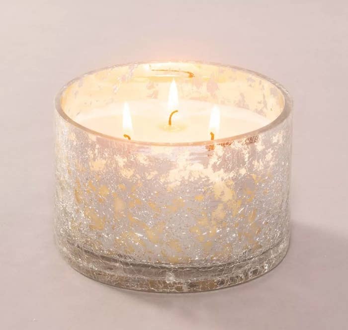 A speckled glass jar candle