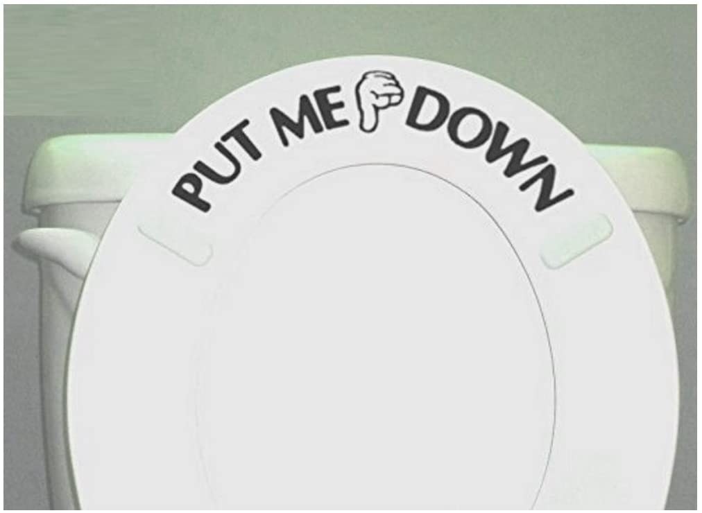 toilet with seat up that has a decal on it that says put me down
