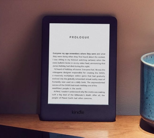 A black Amazon Kindle atop a desk
