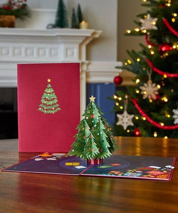 card with a christmas tree pop-up in the middle