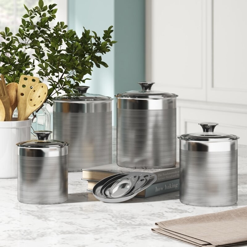 The canisters and scoops on a kitchen counter