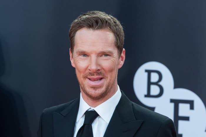 Cumberbatch smiles for a photo in front of the BFI logo
