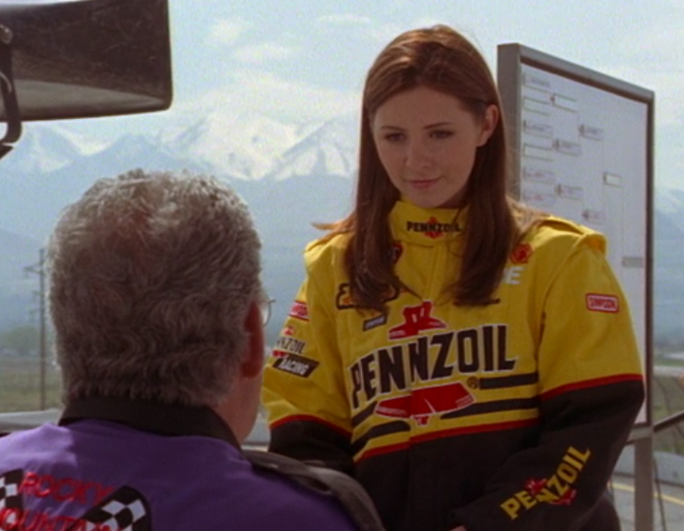 Beverley wearing a racing jacket at a competition in &quot;Right on Track&quot;