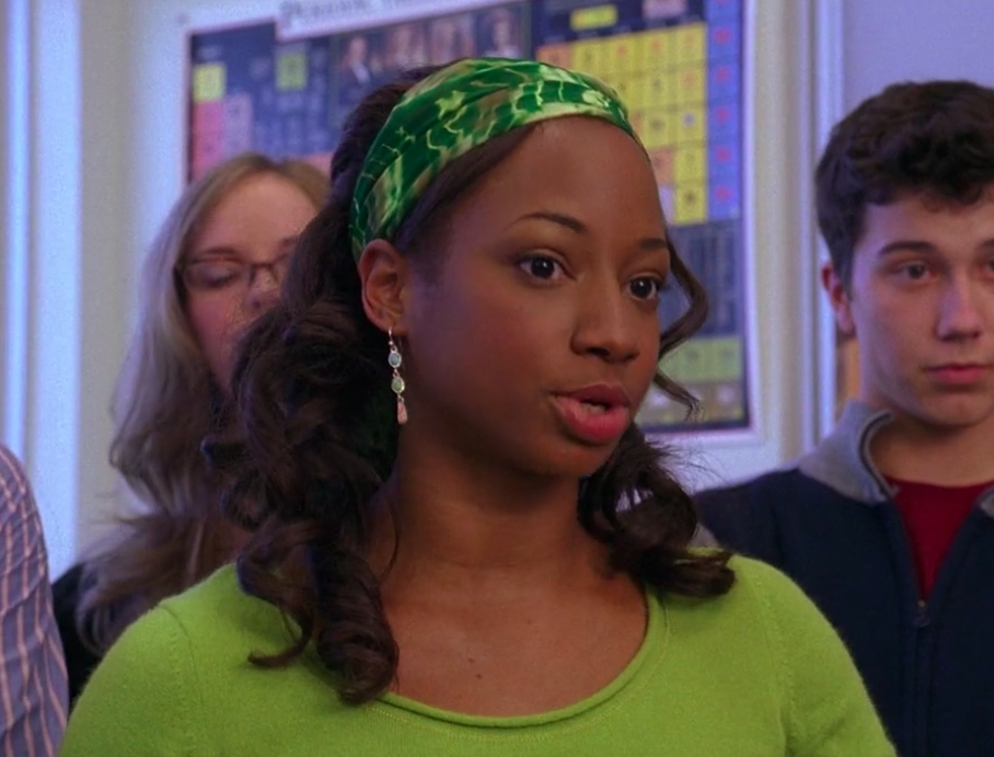 Monique wearing a green top and matching headband in &quot;High School Musical&quot;