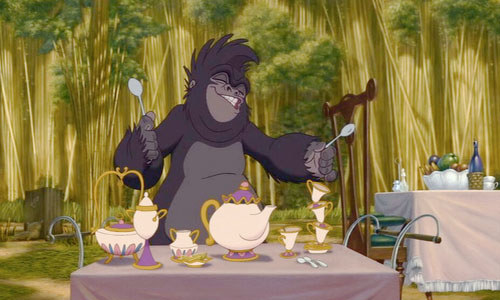 Terk from tarzan playing with the beauty and the beast tea set