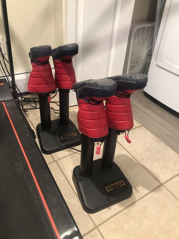 review photo of two boot warmers with boots drying on them