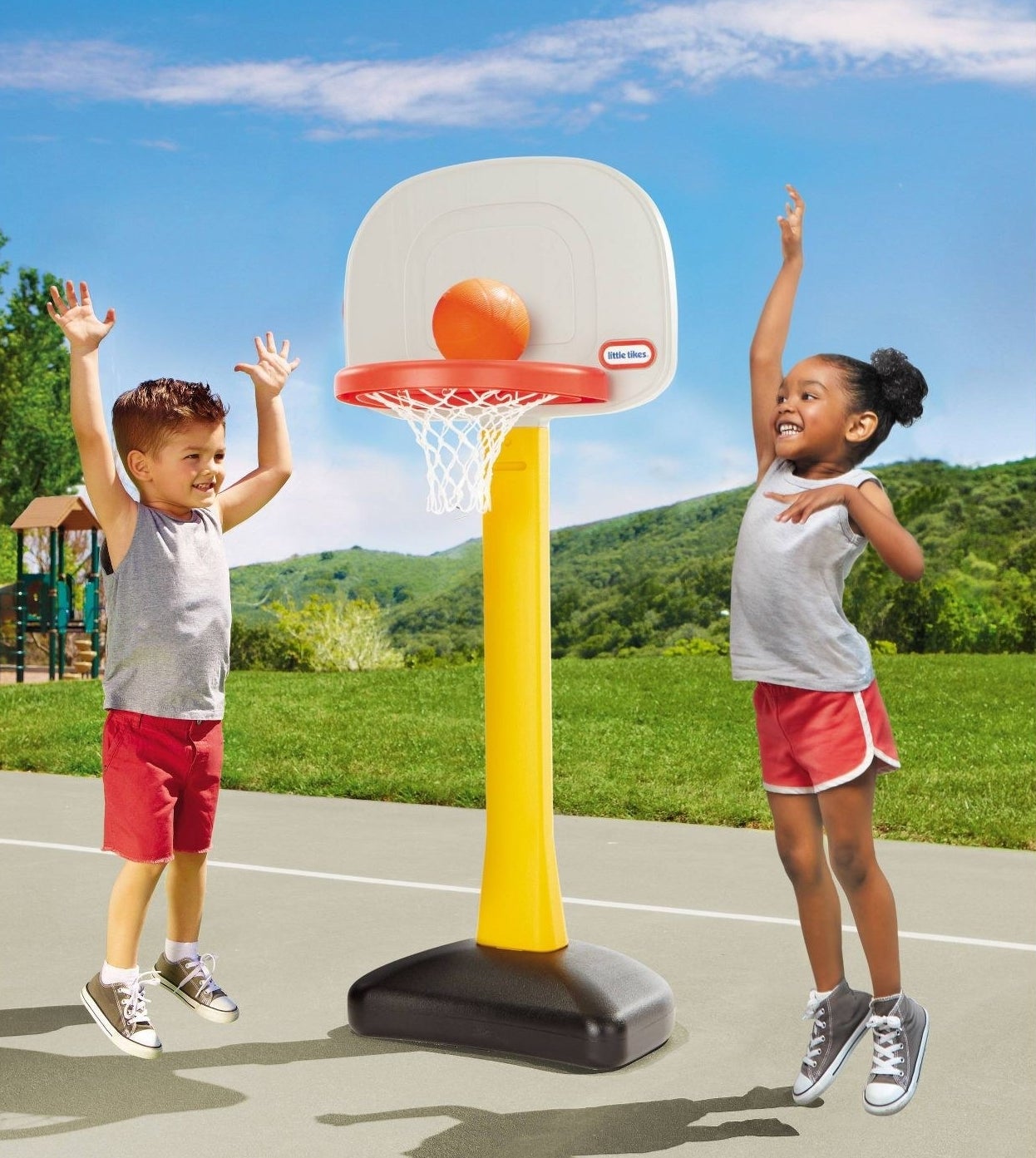 Kids playing with basketball set